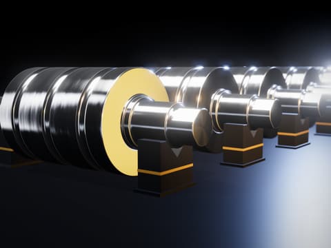 3D view of five finished rolls on V-block stands in a row